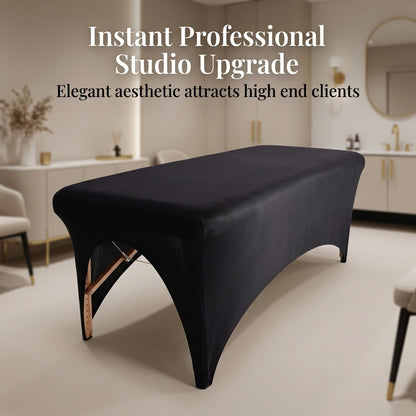 Black treatment table in a spa setting with text about professional studio upgrade.