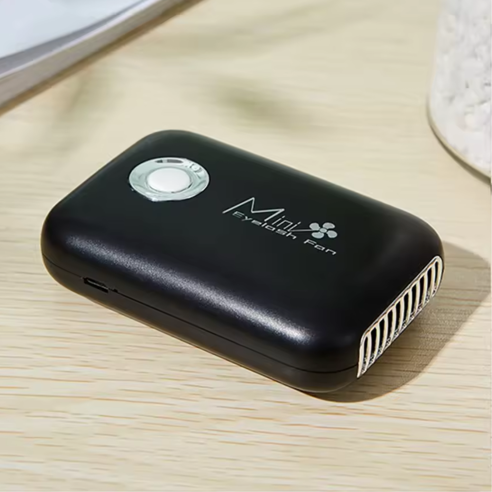 lashfan-black-1 Black handheld fan with 'Mini Fresh Fan' branding on a light