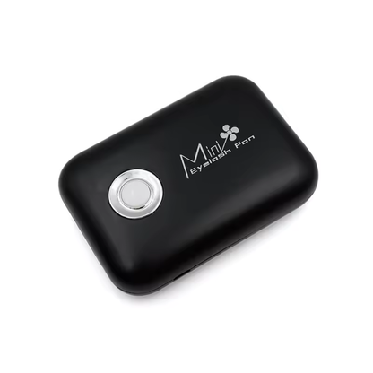 lashfan-black-2 Black handheld device with a silver button on a white background